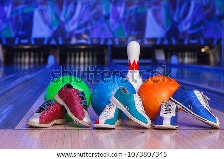 bowling shoes, bowling pins and ball for play in bowling