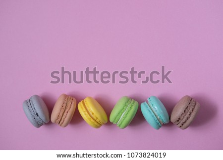Macaron arranged on a pink background