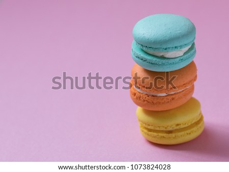 Macaron arranged on a pink background