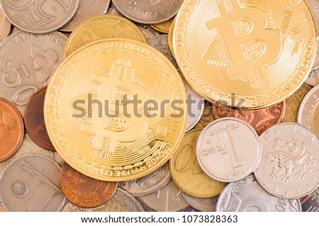 Bitcoins and different type of old and new coins from many countries.