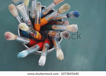 Close up  - Brush in a can on a blackboard