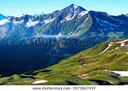 Summer mountain landscape in the early morning with the clouds