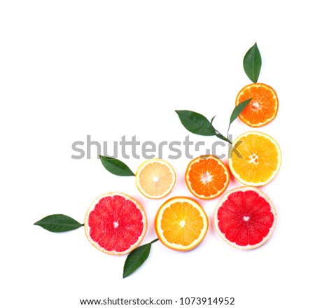 Citrus fruits isolated on white background. Isolated citrus fruits. Pieces of lemon, pink grapefruit and orange isolated on white background, with clipping path. Top view.