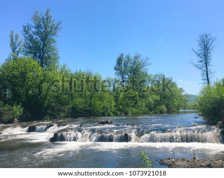 Amazing landscape of the river and waterfall in the wild nature 