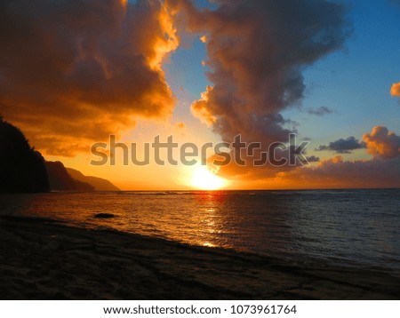sunset on a beautiful beach in kauai
