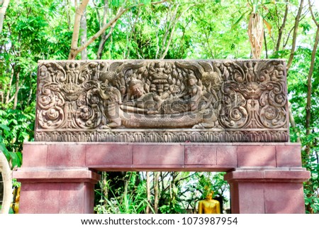 Stone carvings on the entrance to the temple in Thailand get civilization and culture from Angkor Wat, Cambodia.
