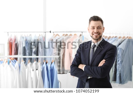 Portrait of young businessman at dry-cleaner's