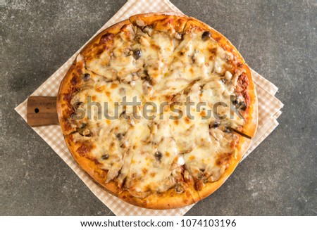 mushroom pizza with miso sauce on table