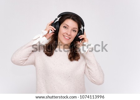 beautiful girl listening to music on headphones in different poses
