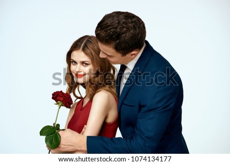   man gives a rose to a woman                             