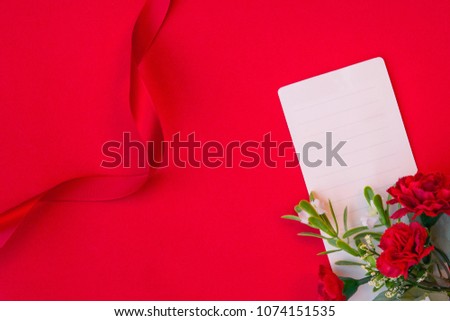 Red Carnation flower with red ribbon