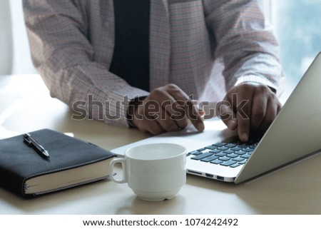 man working computer table hand touching laptop business strategy analysis concept