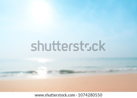 Blur tropical beach with bokeh sun light wave abstract background. Copy space of outdoor summer vacation and travel adventure concept. Vintage tone filter effect color style.
