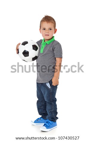 Attractive young boy holding soccer ball. All on white background.