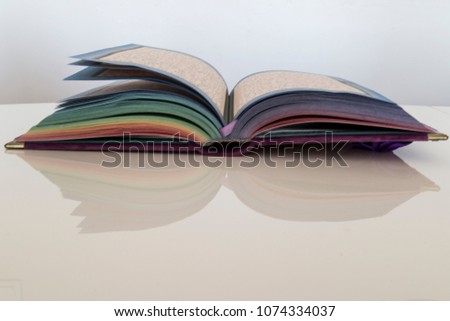 Colorful Koran on the wooden background. Holy book for Muslims for Ramadan concept.