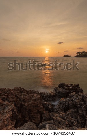 Long Exposures Twilight sunset and sea waves hitting the rocks. Seascape
