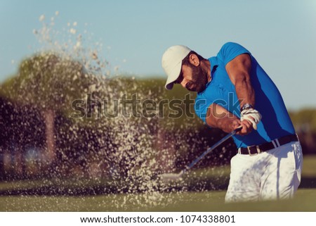 pro golf player shot ball from sand bunker at course Royalty-Free Stock Photo #1074338801