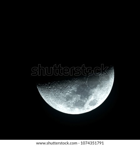 A photo of the half moon on the silent night