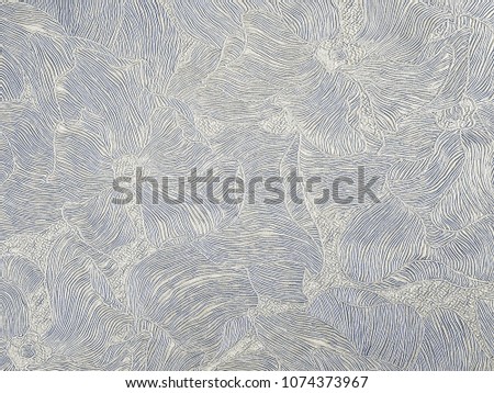 Silver background with embossed floral patterns. Abstract gray background.