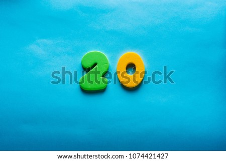 20 years old celebrating classic logo. Colored happy yellow green numbers. Greetings celebrates card. Traditional  digits of ages. Sale, birthday, special prize, % off concept.