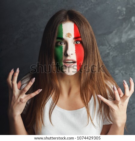 Face of young sad woman painted with flag of Mexica. Football or soccer team fan, sport event, faceart and patriotism concept. Studio shot at gray background, copy space