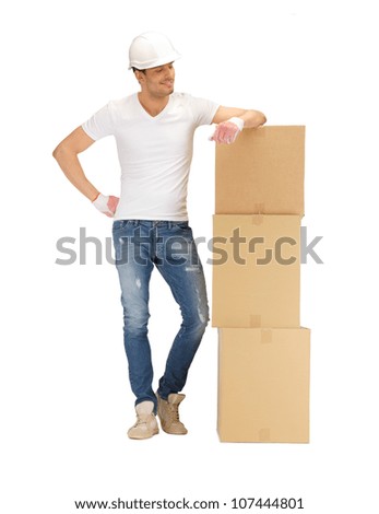 picture of handsome builder with big boxes.