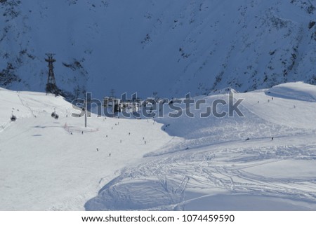 Landscape with snow covered peaks mountains, view Slopes on the skiing resort Elbrus, Caucasus, Russia