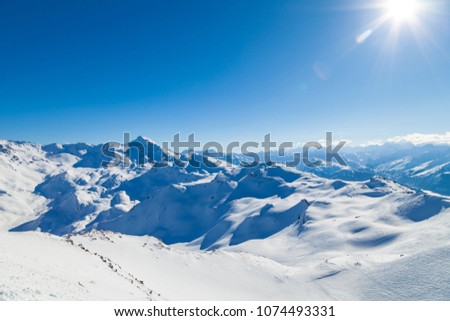 View from summit Cime de Caron (3200 m.)France, the Worlds largest skiing area. Royalty-Free Stock Photo #1074493331