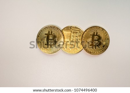 Face and back of the crypto currency golden bitcoin isolated on white background. The concept of virtual international currency and business on the Internet.