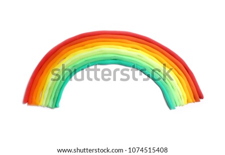 Rainbow made of plasticine on a white sheet of paper