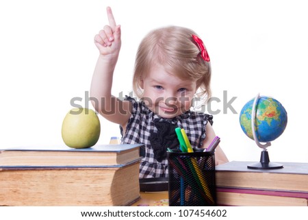 Cute girl in classroom raising finger up over white