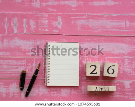 world intellectual property day concept. wooden block calendar 26 April world intellectual property day on bright pink wooden texture background.