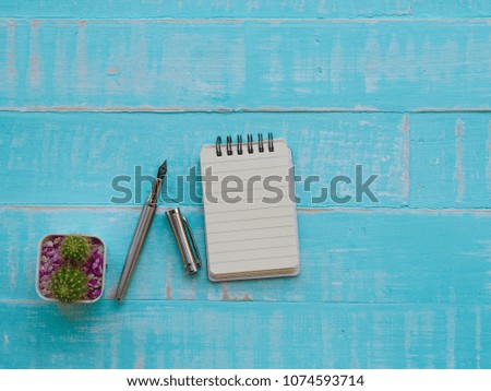 world intellectual property day concept. wooden block calendar 26 April world intellectual property day on bright blue wooden texture background.