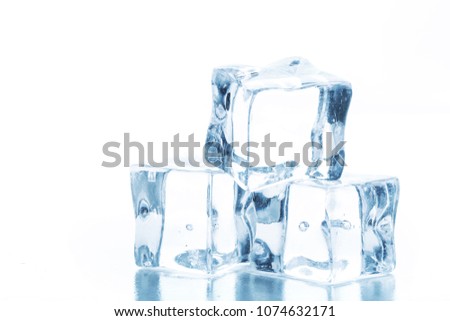 Cubes of clear ice on a white table.