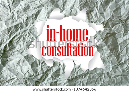 in home consultation word written on a crumpled paper