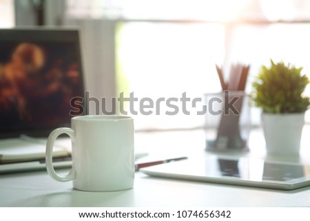 Mug Coffee on business work table.