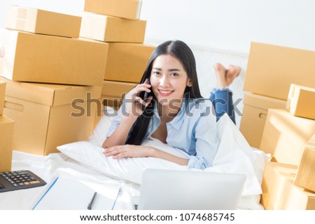 Young Asian Woman Working at home, Young Owner Woman Start up for Business Online. People with online shopping SME entrepreneur or freelance working concept.