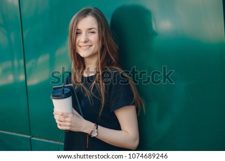 beautiful girl in the city  with tablet and coffe