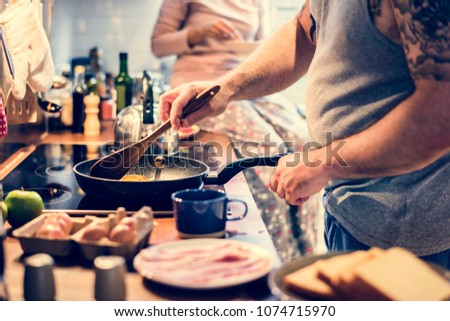 Man cooking breakfast in the kitchen