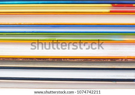 Different colorfull books in stack background image.