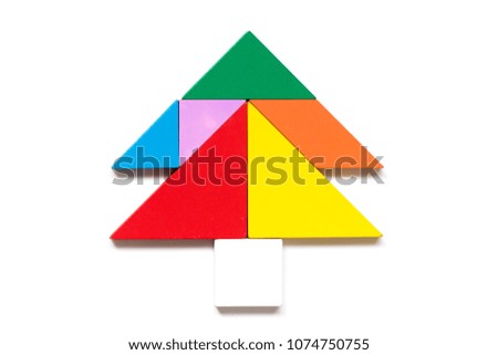 Color wood tangram puzzle in tree shape on white background