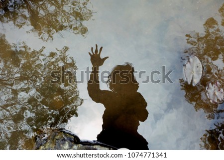 shadow of woman in water background