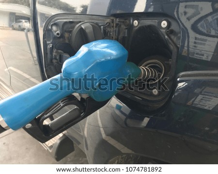 Car refuel at gas station