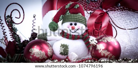 closeup.cute toy snowman and various Christmas decorations