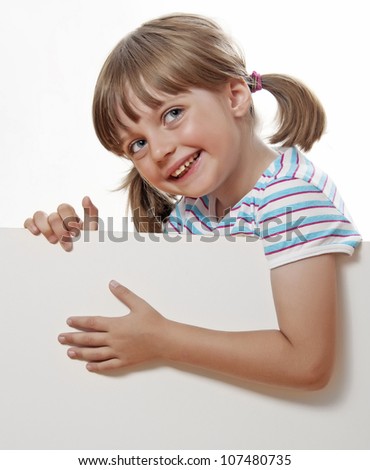 little girl pointing on white blank with empty space for text or picture