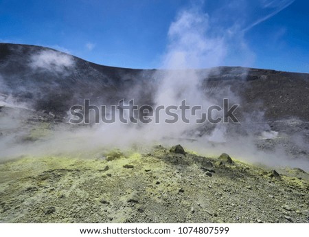 Sulphur gas coming out of the edge of the volcanic crater on the Vulcano island in the Aeolian islands, Sicily, Italy

