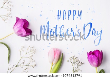 Happy mothers day composition. Flowers on white background. Studio shot.