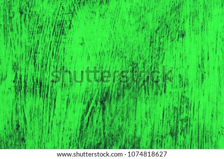 green wooden background. A wooden wall is covered with bright rich old paint