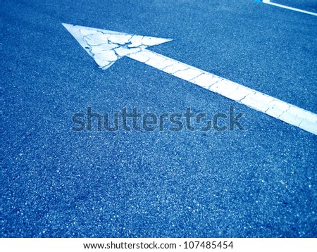    an image of an arrow on the road
