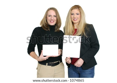 Two women holding blank signs